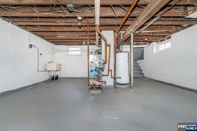 419 Central Ave, Haledon, NJ 07508 - below grade area featuring gas water heater, stairway, and a heating unit