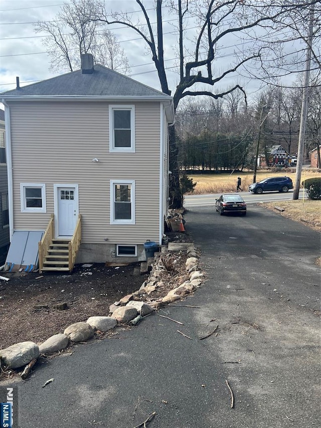 419 Central Ave, Haledon, NJ 07508 - back of house with entry steps and a chimney
