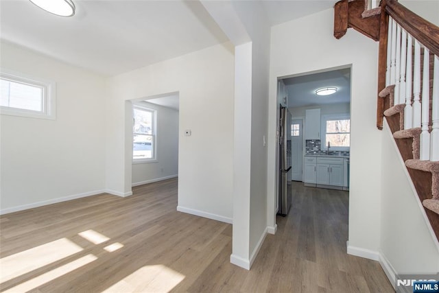 419 Central Ave, Haledon, NJ 07508 - hall featuring light wood finished floors and stairway