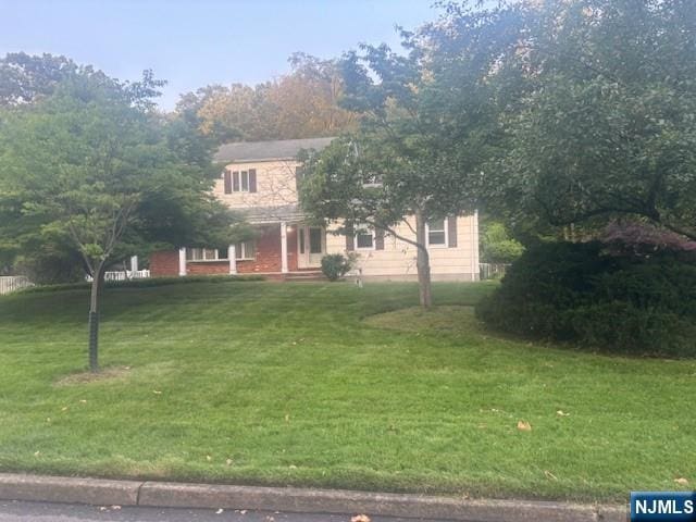 13 Heritage Rd, Old Tappan, NJ 07675 - obstructed view of property featuring a front yard