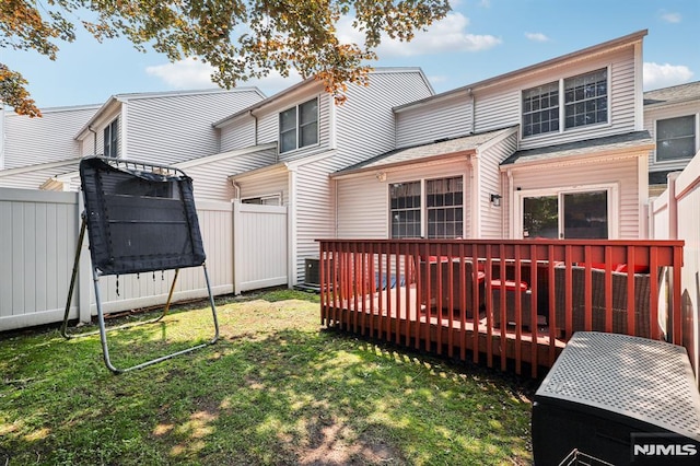 16 Iron Forge Vlg, Pompton Lakes, NJ 07442 - rear view of house featuring a fenced backyard and a wooden deck