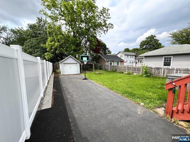 360 Carmita Ave, Rutherford, NJ 07070 - view of yard with a garage, driveway, and an outbuilding