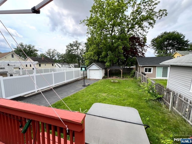 360 Carmita Ave, Rutherford, NJ 07070 - fenced backyard featuring a garage, driveway, and a residential view