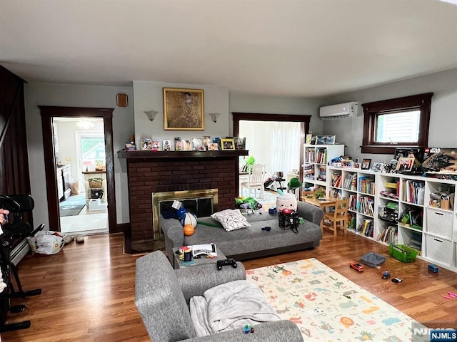 360 Carmita Ave, Rutherford, NJ 07070 - living area with healthy amount of natural light, a wall mounted air conditioner, and a fireplace