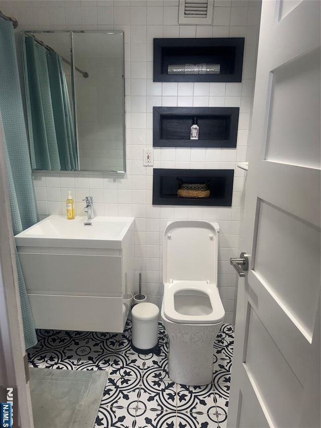 4 Horizon Rd Unit 1006, Fort Lee, NJ 07024 - bathroom with vanity, tile walls, tile patterned floors, and a shower with shower curtain