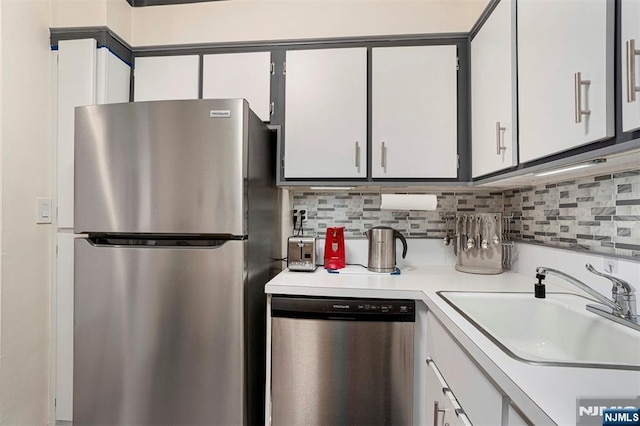 2000 Linwood Ave Unit 3P, Fort Lee, NJ 07024 - kitchen with stainless steel appliances, light countertops, backsplash, and white cabinets