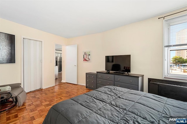 2000 Linwood Ave Unit 3P, Fort Lee, NJ 07024 - bedroom with freestanding refrigerator and baseboards