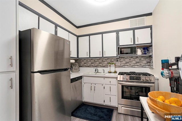 2000 Linwood Ave Unit 3P, Fort Lee, NJ 07024 - kitchen with appliances with stainless steel finishes, light countertops, and white cabinets