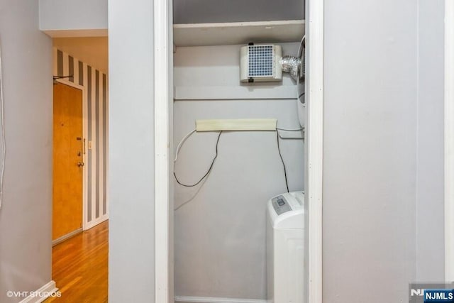24 Hutton Ave Unit 46, West Orange, NJ 07052 - laundry room with wood finished floors and washer / dryer
