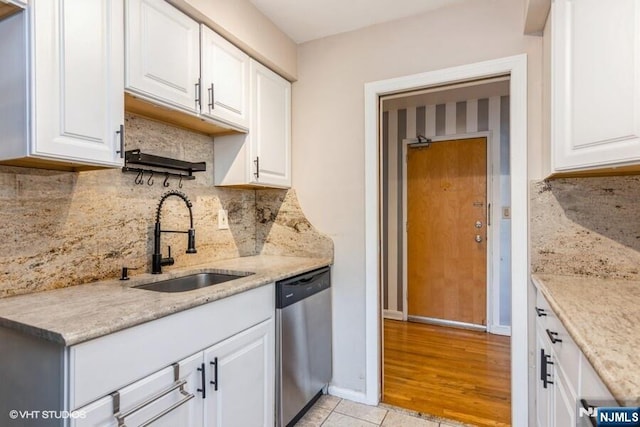 24 Hutton Ave Unit 46, West Orange, NJ 07052 - kitchen featuring dishwasher, white cabinets, backsplash, and light stone counters
