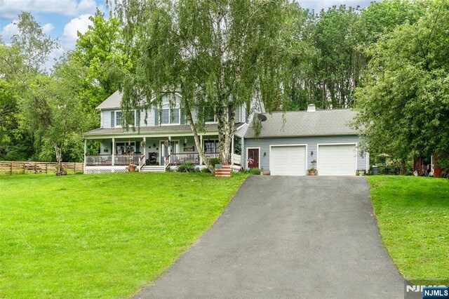 15 Franeks Rd, Hamburg, NJ 07419 - view of front facade with a porch, asphalt driveway, an attached garage, roof with shingles, and a chimney