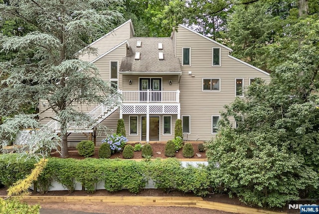 33 Berkshire Rd, Woodcliff Lake, NJ 07677 - back of house featuring roof with shingles and stairway