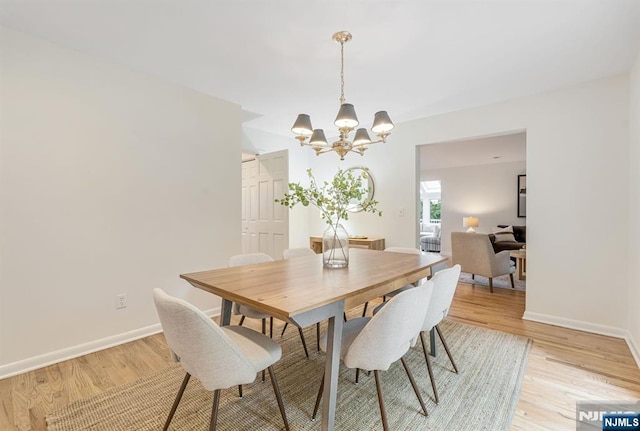 33 Berkshire Rd, Woodcliff Lake, NJ 07677 - dining area featuring a chandelier and light wood-type flooring