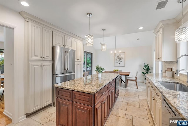 33 Berkshire Rd, Woodcliff Lake, NJ 07677 - kitchen featuring stainless steel appliances, healthy amount of natural light, light stone countertops, and recessed lighting