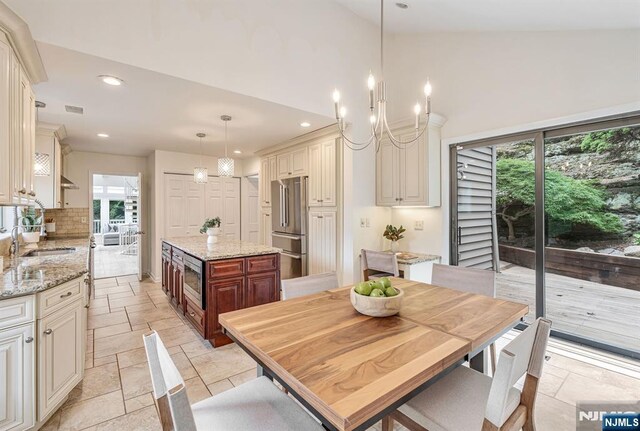 33 Berkshire Rd, Woodcliff Lake, NJ 07677 - kitchen with stainless steel appliances, healthy amount of natural light, recessed lighting, backsplash, and a center island