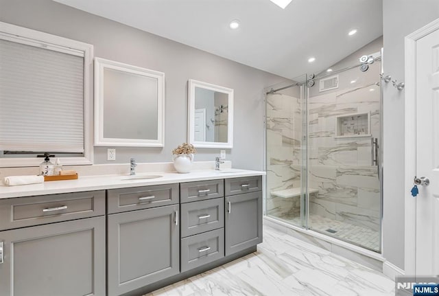 33 Berkshire Rd, Woodcliff Lake, NJ 07677 - bathroom with a marble finish shower, double vanity, marble look tile flooring, recessed lighting, and lofted ceiling