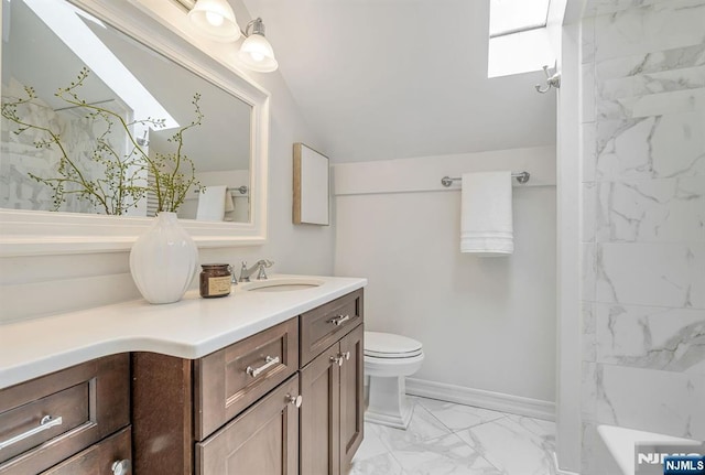 33 Berkshire Rd, Woodcliff Lake, NJ 07677 - bathroom with marble look tiles, vanity, a skylight, and lofted ceiling