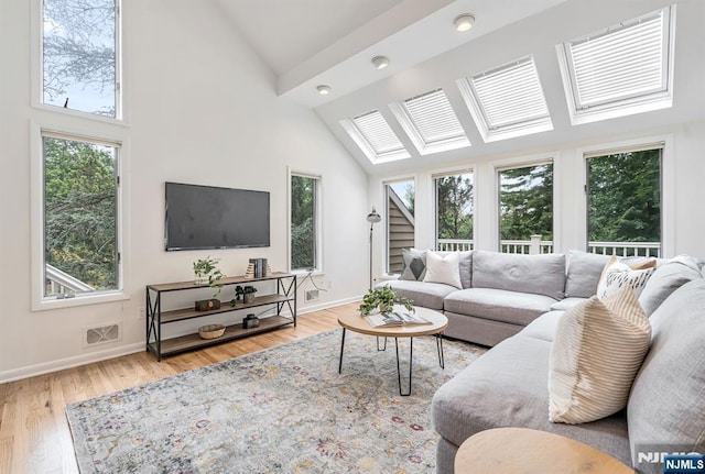 33 Berkshire Rd, Woodcliff Lake, NJ 07677 - living room with high vaulted ceiling, wood finished floors, and a skylight