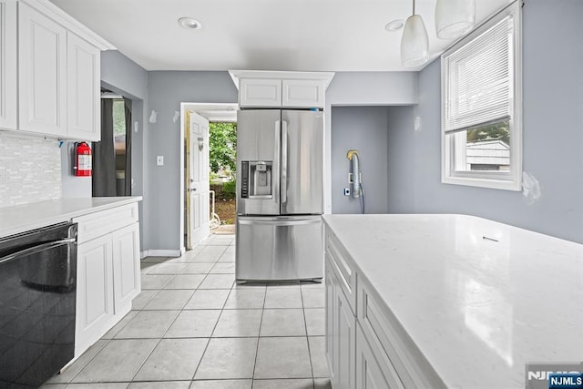 683 E 28th St, Paterson, NJ 07504 - kitchen with stainless steel fridge, black dishwasher, tasteful backsplash, white cabinets, and recessed lighting
