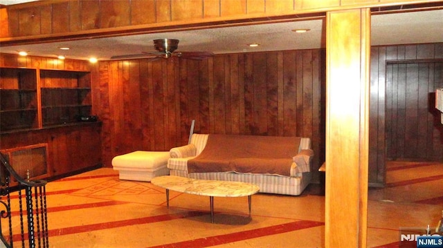 17 Gunther Ave, Lodi, NJ 07644 - living area featuring wood walls and ceiling fan