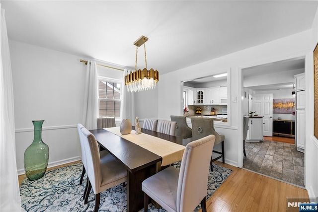 63 Rosedale Ave, Clifton, NJ 07013 - dining room featuring a chandelier and light wood-type flooring