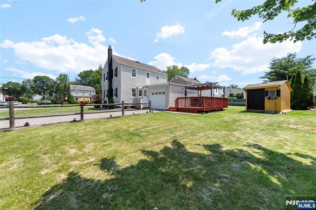 63 Rosedale Ave, Clifton, NJ 07013 - view of yard featuring a storage unit, a pergola, a garage, and a deck