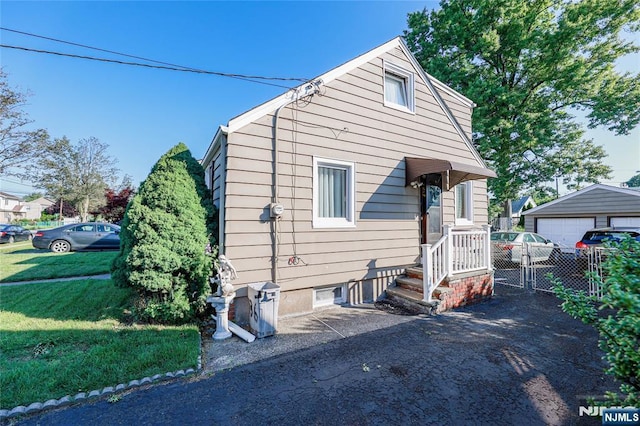 136 Martin Ave, Clifton, NJ 07012 - view of front of house featuring an outdoor structure and a garage