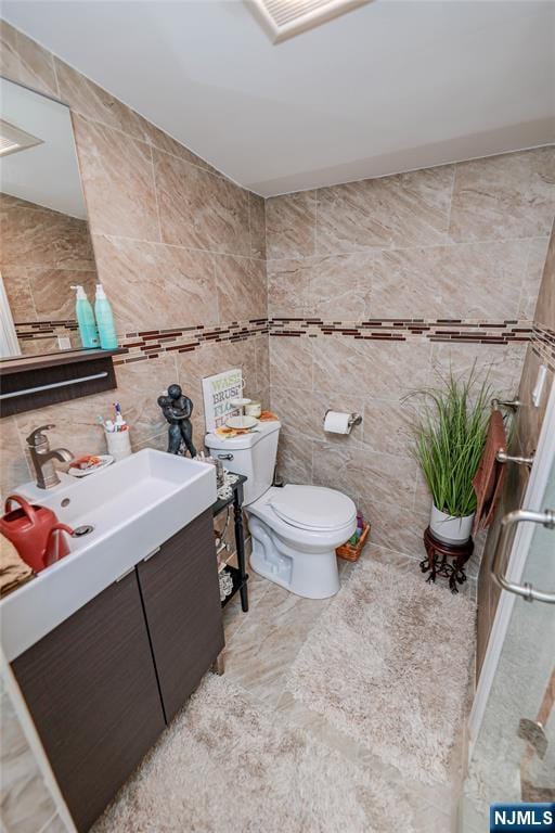 136 Martin Ave, Clifton, NJ 07012 - bathroom featuring tile walls and vanity