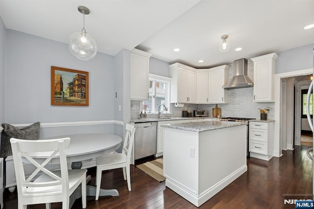 30 Hillcrest Ter, Verona, NJ 07044 - kitchen with wall chimney exhaust hood, stainless steel dishwasher, decorative backsplash, dark wood-type flooring, and white cabinetry