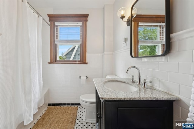 30 Hillcrest Ter, Verona, NJ 07044 - full bath featuring tile walls, vanity, healthy amount of natural light, tile patterned flooring, and shower / bath combination with curtain