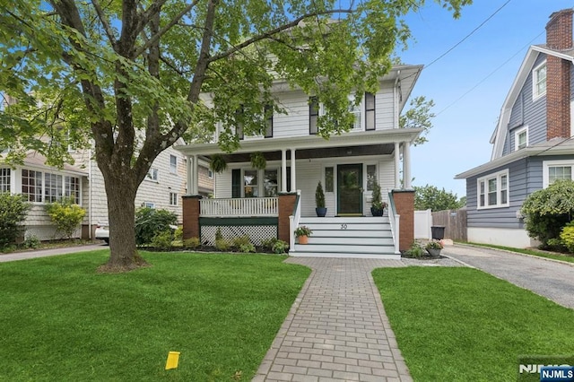 30 Hillcrest Ter, Verona, NJ 07044 - american foursquare style home featuring a porch and a front lawn