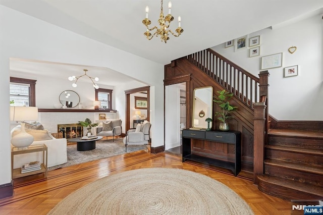 30 Hillcrest Ter, Verona, NJ 07044 - living area featuring a chandelier, stairway, and a fireplace