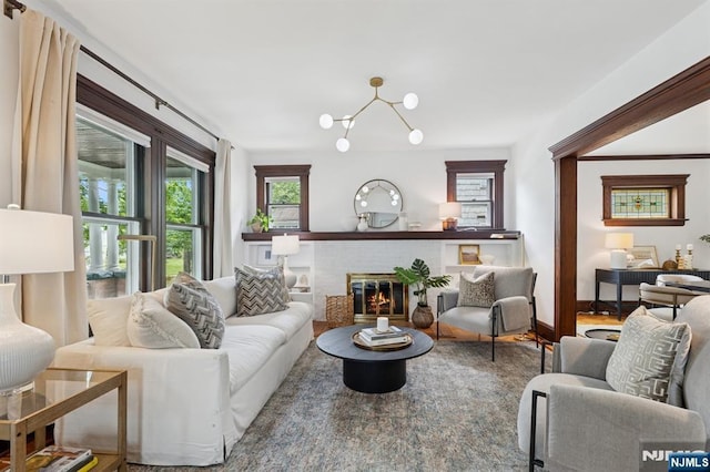 30 Hillcrest Ter, Verona, NJ 07044 - living room featuring a fireplace and a chandelier