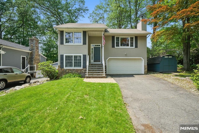 49 Longview Trl, Denville Township, NJ 07834 - raised ranch featuring asphalt driveway, an attached garage, a storage unit, a front lawn, and a chimney