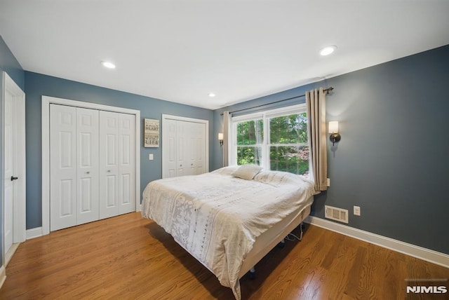 49 Longview Trl, Denville Township, NJ 07834 - bedroom featuring two closets, wood finished floors, and recessed lighting