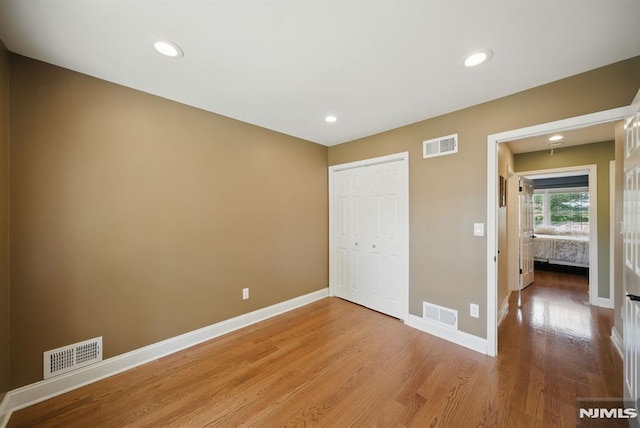 49 Longview Trl, Denville Township, NJ 07834 - unfurnished bedroom featuring light wood-style floors, a closet, and recessed lighting