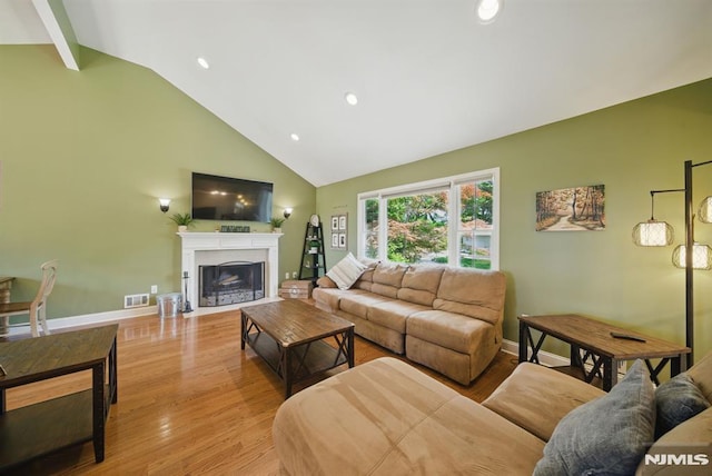 49 Longview Trl, Denville Township, NJ 07834 - living area featuring high vaulted ceiling, a fireplace with flush hearth, light wood-style flooring, beamed ceiling, and recessed lighting