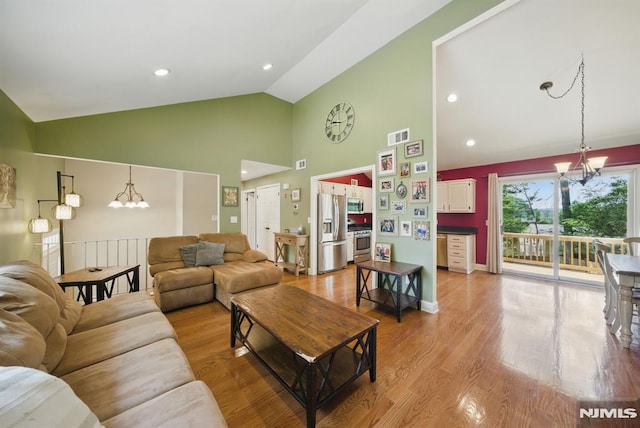 49 Longview Trl, Denville Township, NJ 07834 - living area with a chandelier, high vaulted ceiling, and wood finished floors