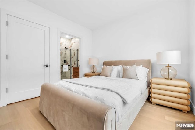 649 38th St Unit 304, Union City, NJ 07087 - bedroom featuring light wood-style flooring and ensuite bathroom