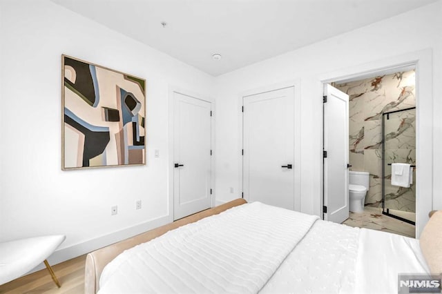 649 38th St Unit 304, Union City, NJ 07087 - bedroom featuring connected bathroom and baseboards