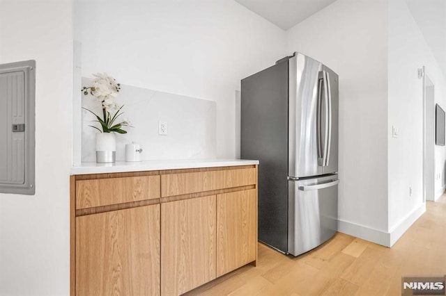 649 38th St Unit 304, Union City, NJ 07087 - kitchen featuring freestanding refrigerator, light wood-type flooring, light countertops, and electric panel