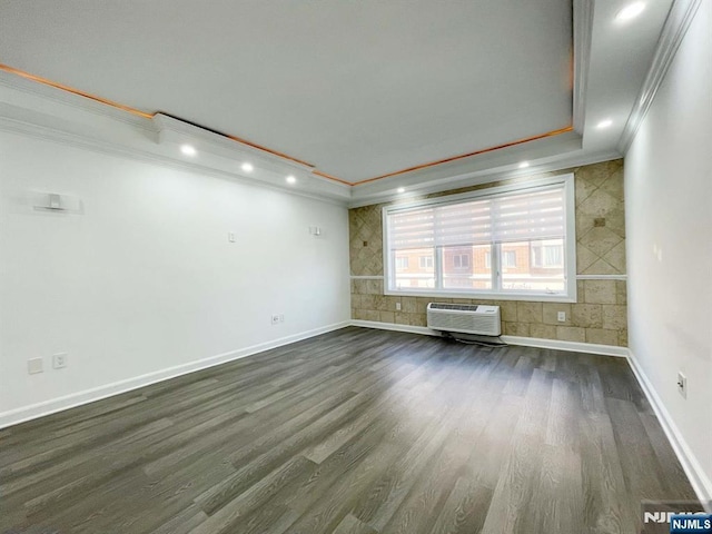 6106 City Pl Unit 6-106, Edgewater, NJ 07020 - unfurnished room with a wall mounted air conditioner, ornamental molding, dark wood-type flooring, and recessed lighting