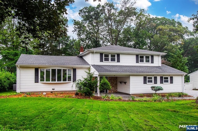 44 Grover Dr, Wayne, NJ 07470 - tri-level home featuring a front yard, a chimney, a patio, and roof with shingles