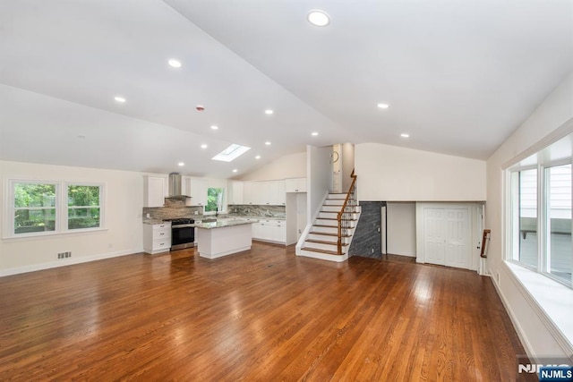 44 Grover Dr, Wayne, NJ 07470 - unfurnished living room with lofted ceiling, dark wood-style flooring, stairway, and recessed lighting