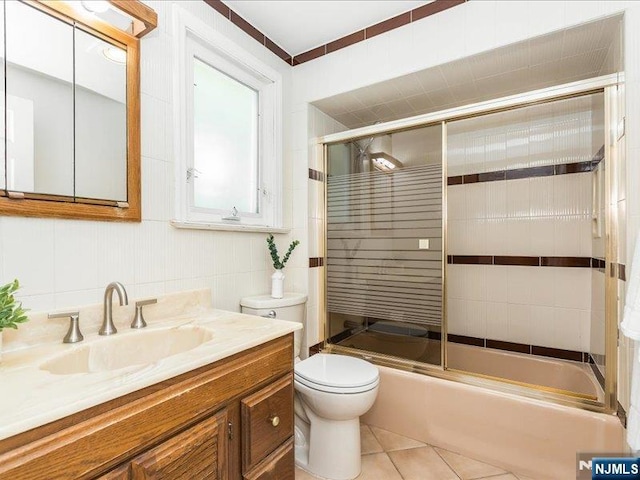 100 Darling Ave, Bloomfield, NJ 07003 - full bath featuring shower / bath combination with glass door, vanity, and tile patterned flooring