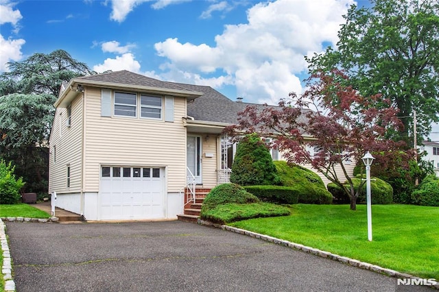 6 Rutgers Pl, Clifton, NJ 07013 - tri-level home featuring a front yard, a garage, driveway, and roof with shingles