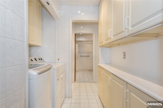 6 Rutgers Pl, Clifton, NJ 07013 - laundry area with tile walls, light tile patterned floors, and washing machine and dryer