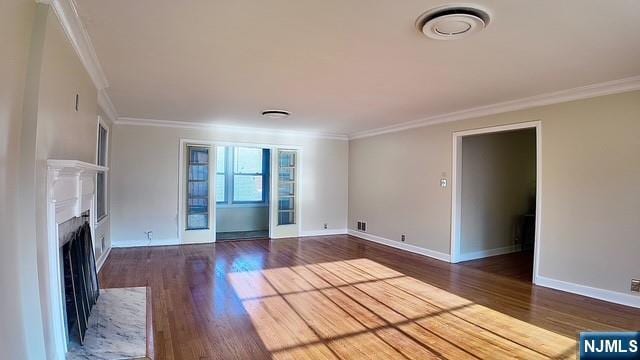 313-321 39th St, Paterson, NJ 07504 - unfurnished living room featuring ornamental molding, wood finished floors, and a fireplace with flush hearth