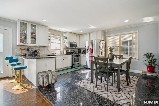286 State Rt 17, Rutherford, NJ 07070 - kitchen featuring stainless steel appliances, ornamental molding, backsplash, glass insert cabinets, and recessed lighting