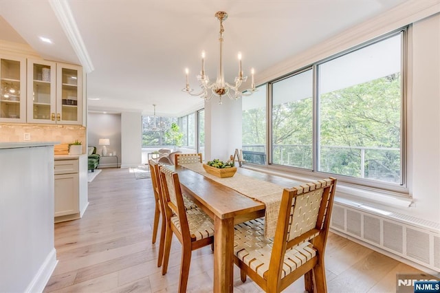 1 Claridge Dr Unit 418, Verona, NJ 07044 - dining area with a chandelier and light wood-style floors